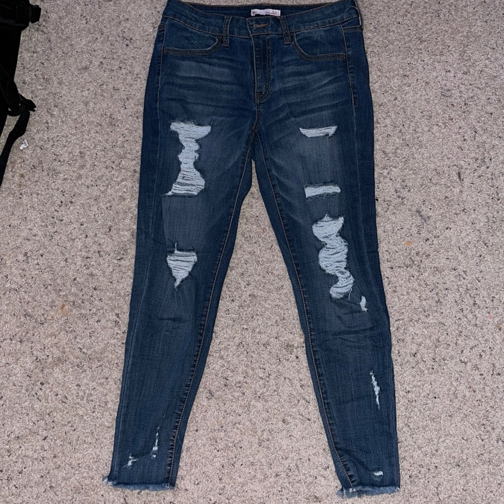 Low rise, ripped skinny jeans. Size 11 from SO. Zip-up with a button.